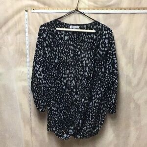 Jennifer Lopez open front woman’s blouse/shell.